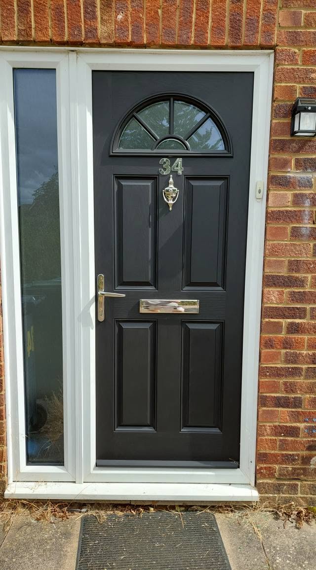 Black front door with a glazed side panel