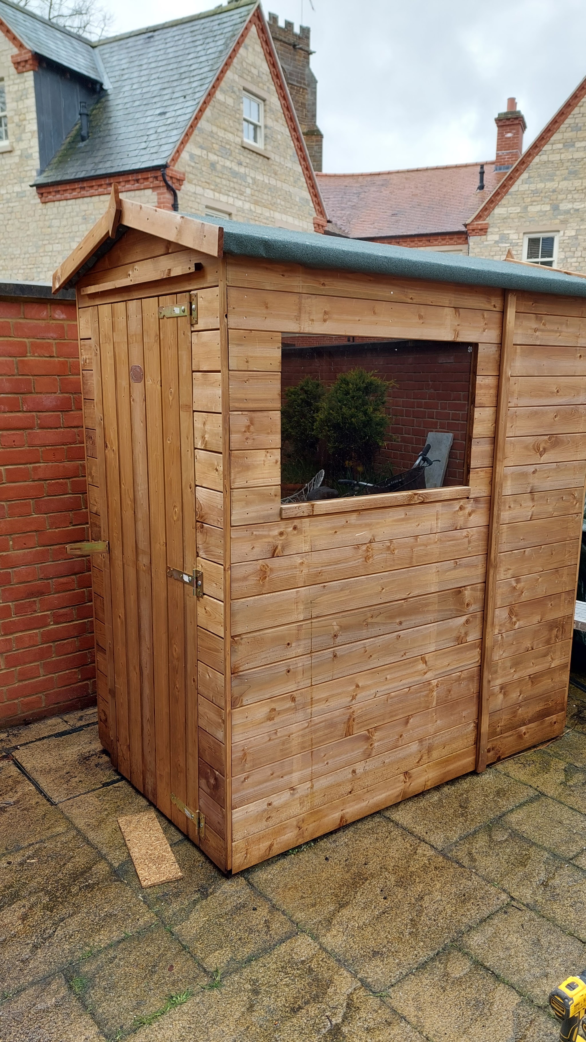 Small timber garden shed with a window